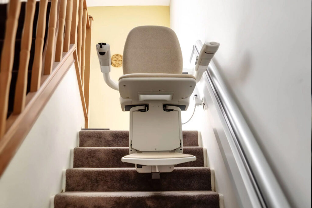 A Stairlift stopped and swivled at the top of stairs installed by AMS Group Ltd